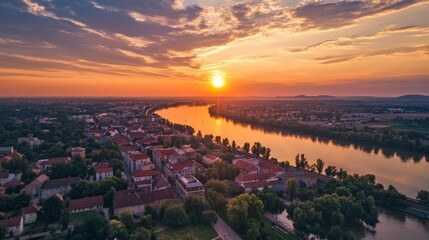 Obraz premium Cityscape at Sunrise over River