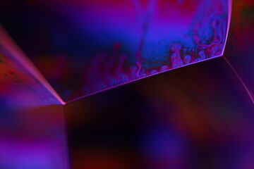 Purple liquid pattern on black background, fluid motion, dark horror background, liquid in macro,...