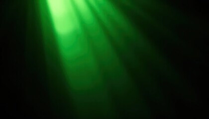 green spotlight illuminating from the top on dark background, with light rays 