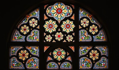 Fototapeta premium A stunning stained glass window featuring intricate floral designs, perfect for architectural, religious, or art-related projects.