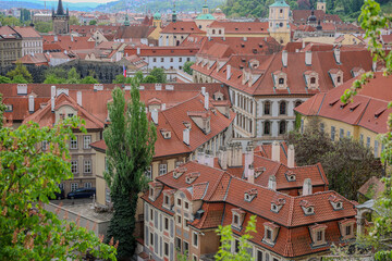 Prague city's rooftops and town, with traditional Baroque style buildings and architecture.