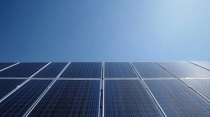Obraz premium Solar Panels Reflecting Sunlight Against Clear Sky