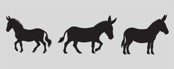 Set of three black donkey silhouettes in different poses on a light gray background