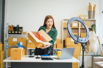 A beautiful Asian woman shares her journey of selling shoes via live camera on social media from...