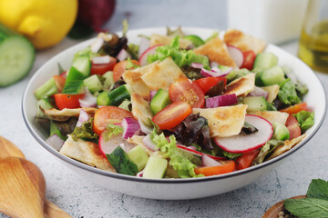 A bowl with Fattoush - Traditional Levantine salad	
