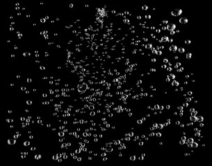 Many bubbles oxygen in the water, in underwater clear liquid with bubbles flowing up on the water surface, which represent freshness of drink