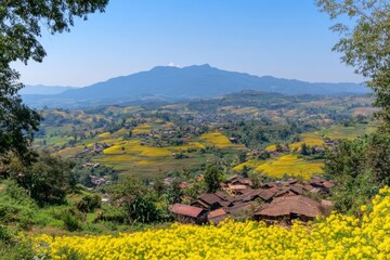 Obraz premium A panoramic view of a Hmong village nestled in the hills of Laos, with terraced rice fields stretching into the distance under a clear blue sky