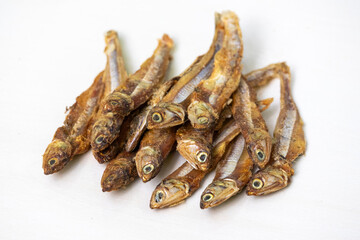 Close-up of dried anchovies, isolated on a white background. Locally known as Mola Shutki in Bangladesh.