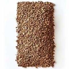 Small freeze dried instant coffee granules are making a rectangular shape on a white background, creating a textured and aromatic scene