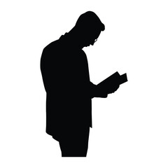 Silhouette of a person reading a book