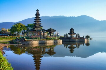 Morning view of Ulun Danu Beratan Temple on the lake. The most iconic and famous temple in Bali surrounded by mountains