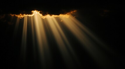 Golden sun rays breaking through dark clouds.