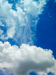 Clouds floating in blue sky.
