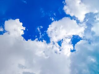 Clouds floating in blue sky.