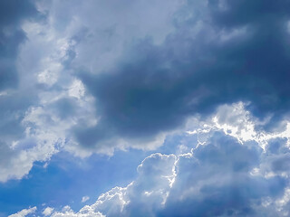 Clouds floating in blue sky.