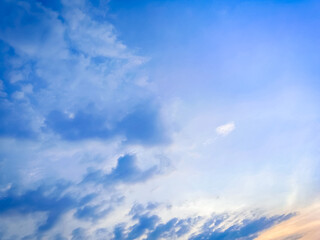 Clouds floating in blue sky.