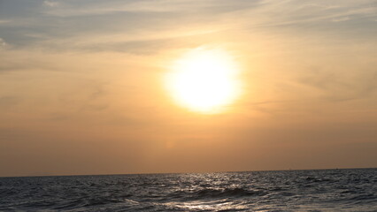 Horizon Sea Sky Background, Sunset sky clouds over the sea in the evening with Orange and yellow sunlight Golden hour in the Summer landscape, Dusk sky seascape backgrounds