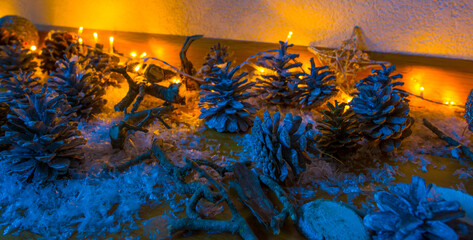 Christmas decorations illuminated by electric candles on an oak floor in a living room, Almere,...