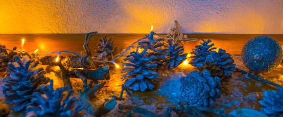 Christmas decorations illuminated by electric candles on an oak floor in a living room, Almere,...