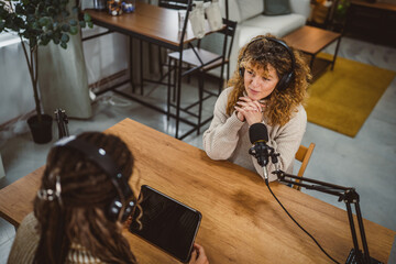 adult woman presenter interview female guest and stream audio podcast
