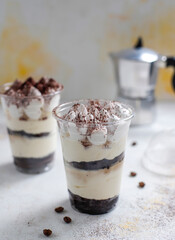 Traditional italian desert tiramisu in a jar.