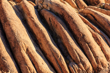 The image is of a rocky cliff with a lot of texture and detail