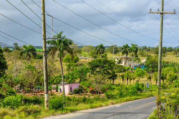 A rural area with a road and a house