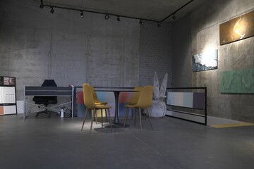 Modern office interior with minimalist design and abstract art.