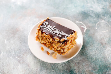 Snickers cake with caramel, peanuts and buttercream.