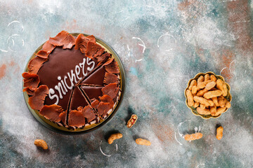 Snickers cake with caramel, peanuts and buttercream.