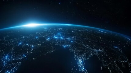 Obraz premium A view of Earth from space, illuminated by city lights and a sunrise.