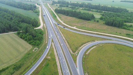 Countryside highway interchange in Europe under a blue sky