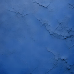 A rich blue textured wall background featuring cracks and imperfections, ideal for adding depth and character to various design projects.
