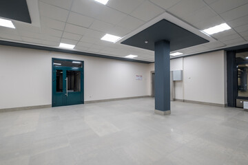 panorama view in empty modern hall with columns, doors and panoramic windows at night