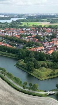 over fortified town brielle beautiful green parks historic 17th century church views town's fortifications aerial panning view netherlands heritage site parkland dutch 