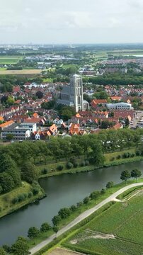 moving towards historic 17th century church fortified town brielle netherlands revealing intricate fortifications surrounding forward aerial shot view motion dutch history 