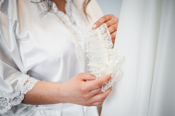 Bridal Elegance: An Intimate Moment of Preparation in a Silken Robe