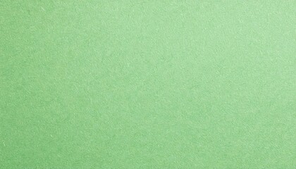 Obraz premium macro view of pale green paper with faintly visible grain texture, ideal for eco-friendly crafts, stationery, and artistic projects 