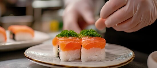 Homemade sushi topped with mentai and garnished with green herbs presented on a white plate in a cozy kitchen setting