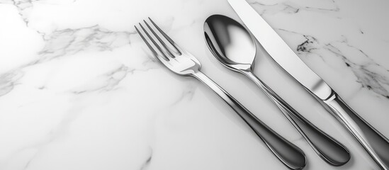Elegant silver cutlery set on a marble table showcasing modern dining aesthetics for upscale kitchen decor and luxury dining experiences