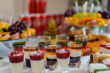 Colorful Dessert Table with Varied Treats and Refreshing Drinks