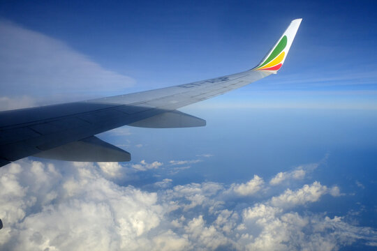 Kenya Airways Boeing 737 800 MAX wing and clouds