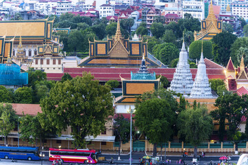 The throne hall inside the Royal Palace complex and the new skyscrapers in Phnom Penh, Cambodia