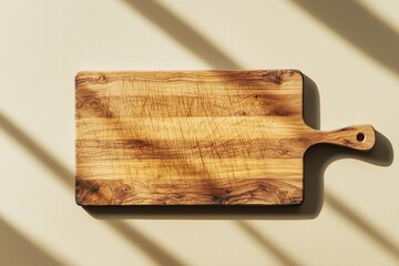 A rustic wooden cutting board with a handle, placed on a light surface, casting soft shadows.