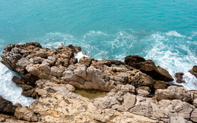 Nice, France - May 03, 2024: Rocky Mediterranean Coastline with Crystal Clear Turquoise Waters and Limestone Formations