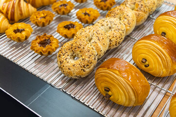 heap of fresh baked bagels and bread on shop Baked goods whole grain artisan bread