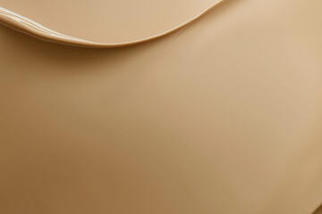 tan background with a cream colored object in the foreground. The object is a cream colored item that is in the foreground of the image