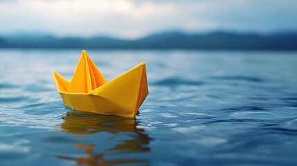 Yellow paper boat floating on sea ocean water. origami sailboat ship toy freedom concept, tourism cruise journey, river, lake, explore adventure, waves, brave, resilience, hope, fragility.