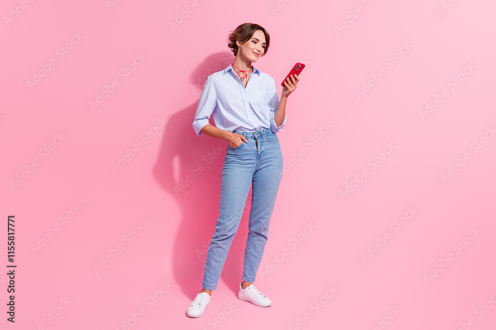 Poster full length portrait of stunning nice person hold use smart phone texting isolated on pink color bac