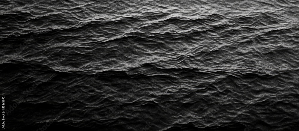 Poster aerial view of dark ocean waves creating a textured pattern with ample negative space for overlaying